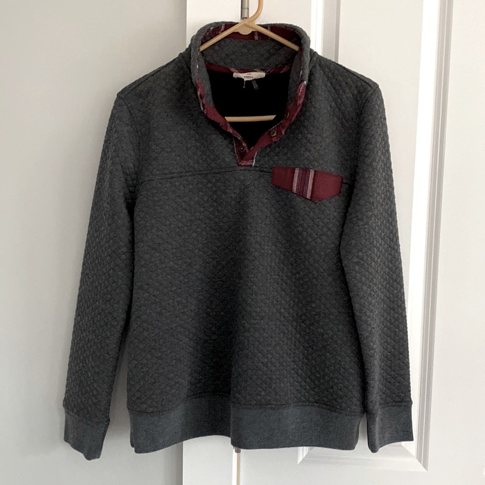 Quilted pullover with patches on elbows.